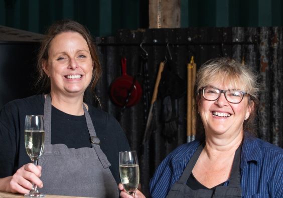 Beth Ashfield and Andrea Broadhurst raising a toast