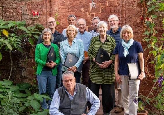 Compere, well-known historian Dr Todd Gray, with some of the choir's members