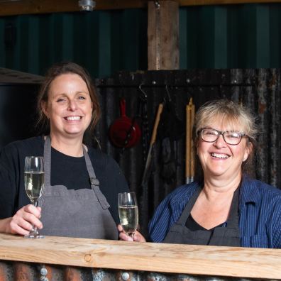 Beth Ashfield and Andrea Broadhurst raising a toast